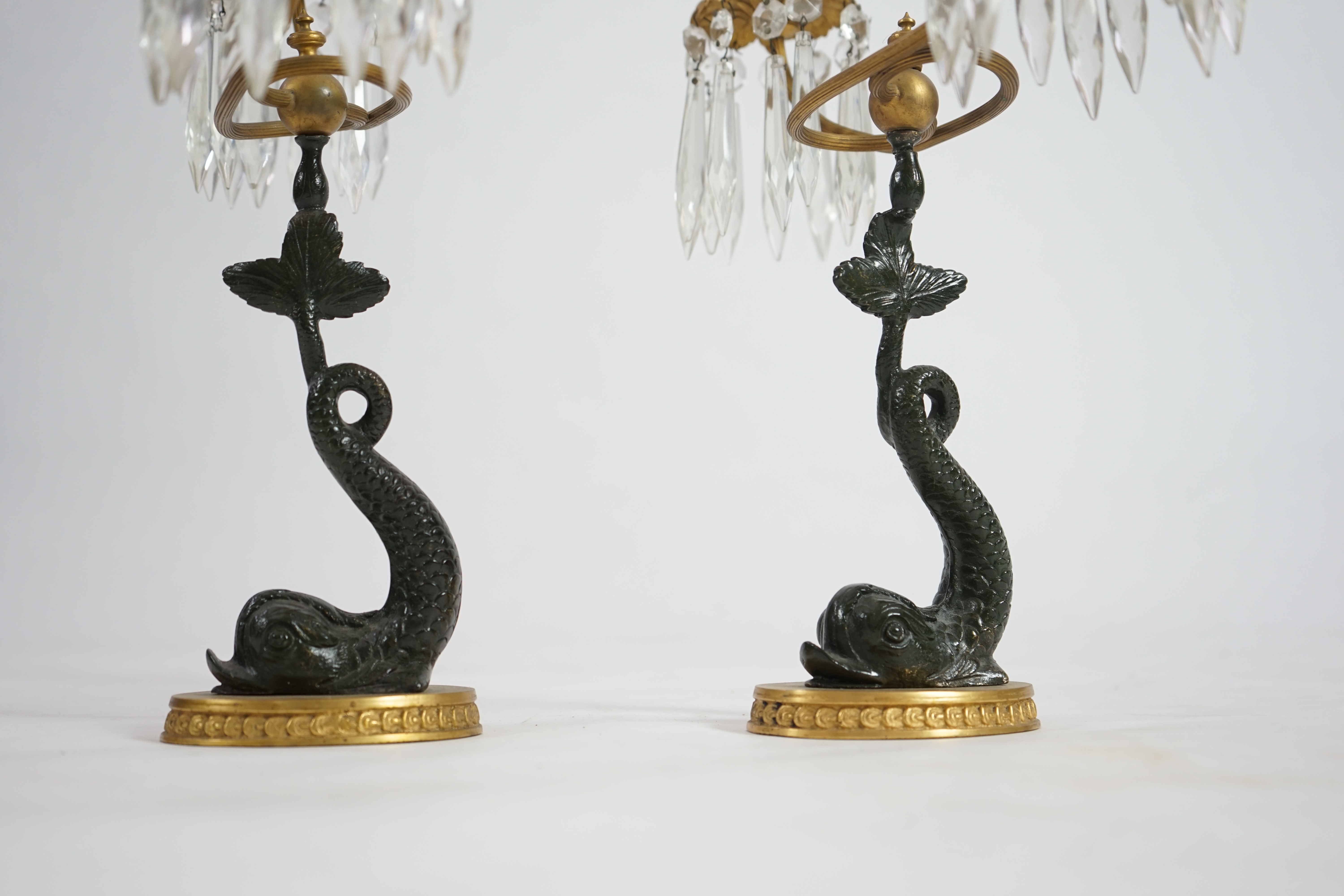 A pair of 19th century bronze and ormolu twin sconce candelabra